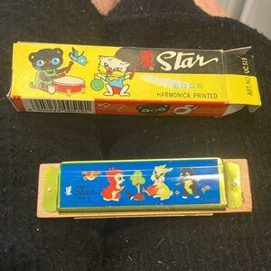 Vintage star harmonica in original box never been used